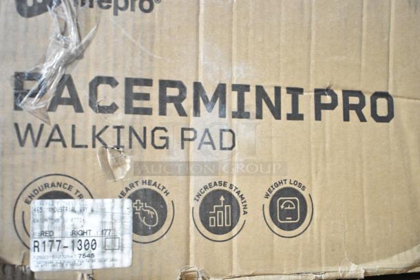 BRAND NEW SCRATCH AND DENT! LifePro Pacer Mini Pro Walking Pad box showing features and logos. Box shows visible creases and marks.