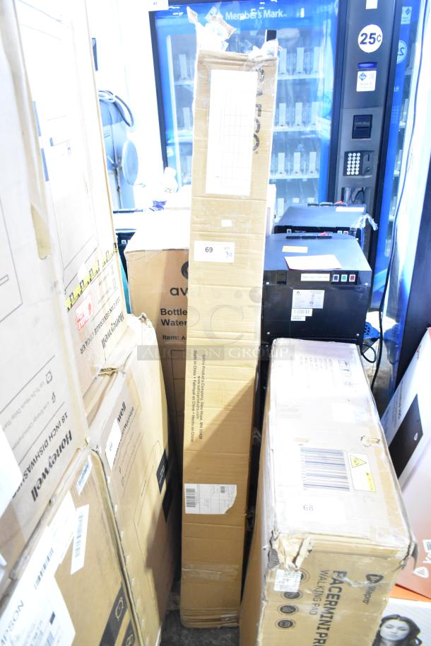 Cardboard boxes containing 2 brand new Safco 4163BL black metal coat racks, 21"x21"x70", visible shipping labels.