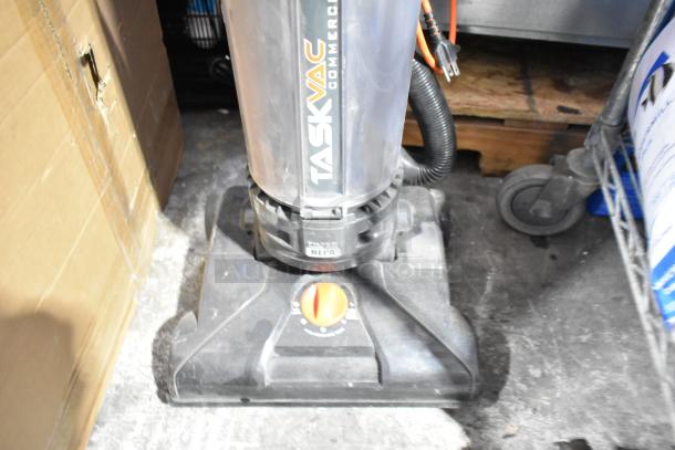 Hoover CH53010 Vacuum Cleaner, silver and black, visible "TASKVAC" label, 120 Volts, 1 Phase, used condition.