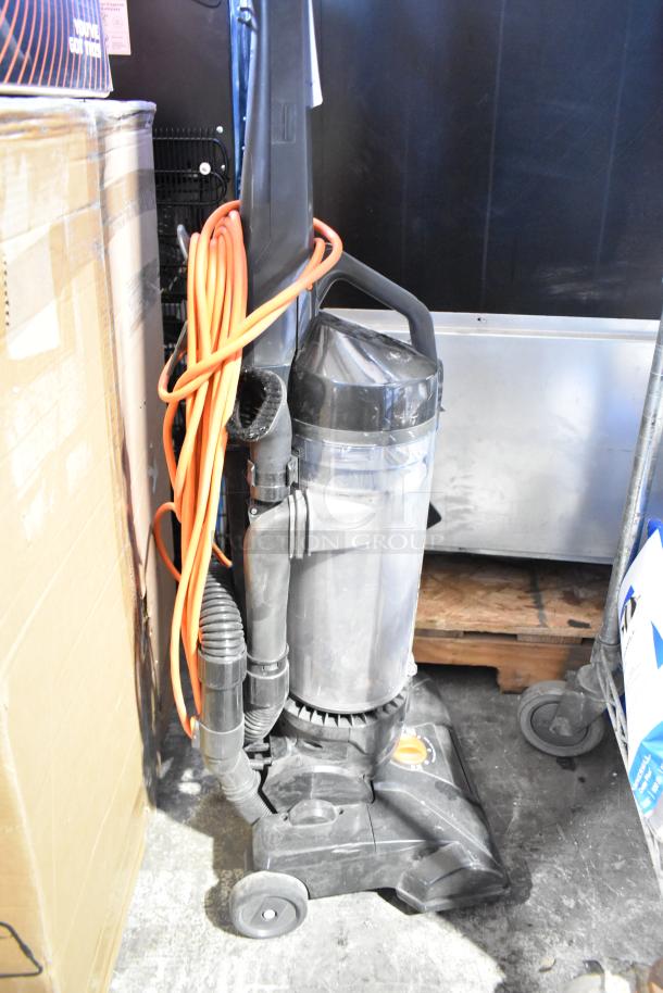 Hoover CH53010 vacuum cleaner, upright model. Includes power cord, hose attachments. Condition appears used. 120V, 1 Phase.