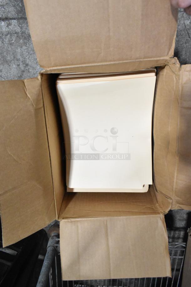 Open box with manila end tab file folders visible. Part of a mixed auction lot including pride string lights and more.