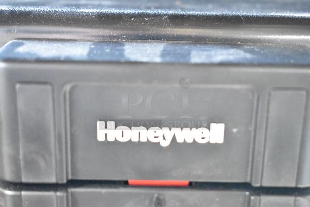 Honeywell safe, black, no key included, visible Honeywell logo, secure storage solution, gently used condition.
