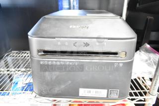 Fellowes Powershred LX180 black cross-cut shredder, slightly worn, features icons on front, clearance label at bottom.