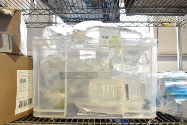 Two-tier plastic bin with Diversey floor and neutral cleaners, Gojo foam handwash, and Ajax cleaner; visible labels detail contents.