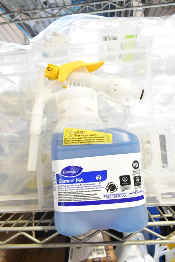 Two tier lot with Diversey Glance NA multi-surface cleaner, labeled for non-ammoniated use. Contains attachments.