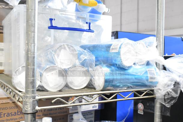 Two-tier shelf with Diversey floor cleaners, Gojo foam handwash, and Ajax cleaner, all in sealed containers.