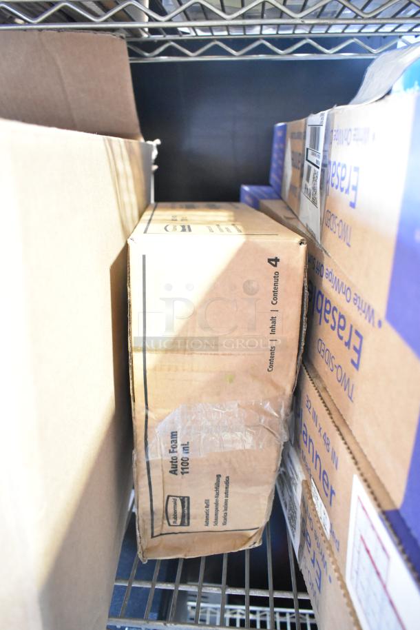 Two-tier auction lot featuring various cleaning supplies, including Diversey floor cleaners, Gojo handwash, Ajax cleaner, in original packaging.