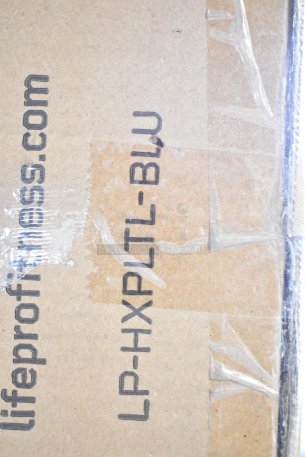 Box of LifePro LP-HXPLTL-BLU Hexaplate Lite Vibration Plate, new with scratch and dent, visible branding and model info.