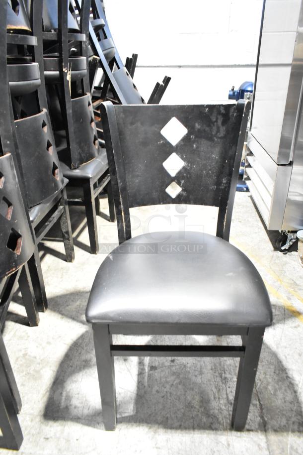 Set of 21 black dining chairs, features black seat cushions, diamond-patterned backrest, good condition.