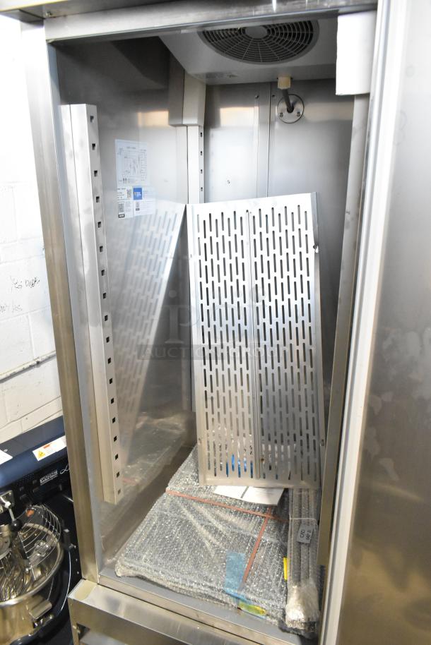 Brand new Avantco 178SS1RHC commercial single door cooler, 115V, 1 Phase. Interior view with rack and labels visible.