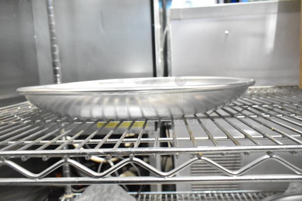 Avantco 176SFD16TRY aluminum seafood tray, 15.75x2", new scratch and dent, displayed on metal rack.