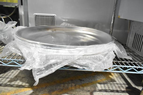 Avantco 176SFD16TRY aluminum seafood tray, 15.75x2", new condition, wrapped in plastic, on metal shelf. Model 178SS1RHC.