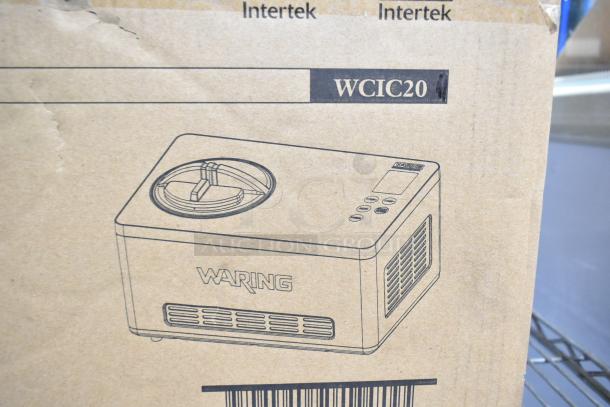 Brand new Waring WCIC20 2 Qt. ice cream maker. Scratch and dent condition, 120 volts, 1 phase. Box illustration visible.