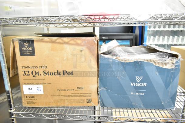 Boxes of Vigor SS1 Series 32 Qt. and 20 Qt. stainless steel stock pots, both scratch and dent, with visible branding.