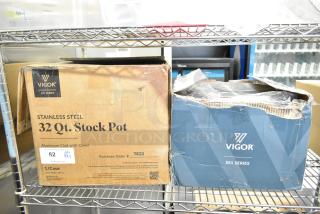 Boxes of Vigor SS1 Series 32 Qt. and 20 Qt. stainless steel stock pots, both scratch and dent, with visible branding.