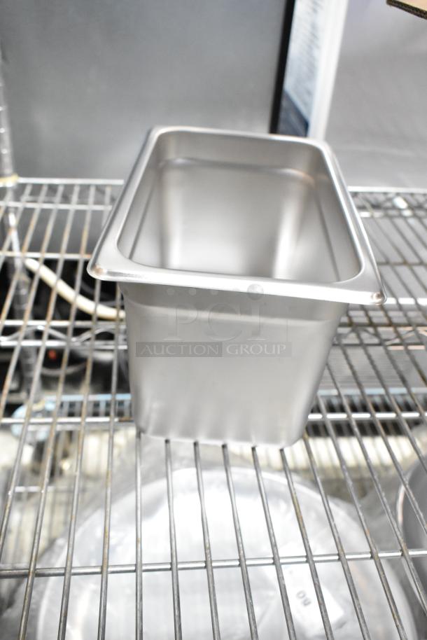 Stainless steel food container, brand new, minor dents. Part of a lot including bowls and trays. Auction for 10 items.