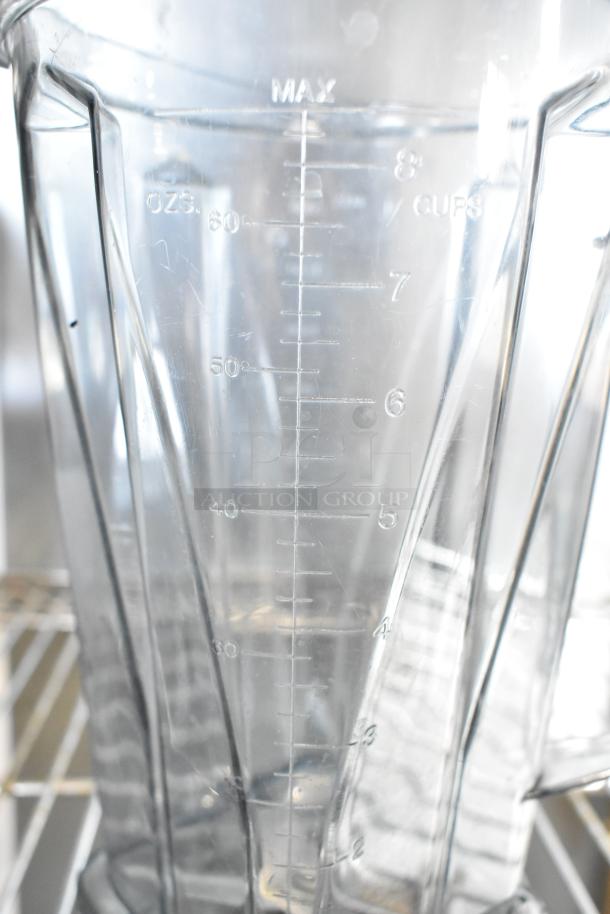 Two Vita-Mix VM0102/VM0103 blenders without lids, marked in ounces and cups. 120 volts, one phase, no visible damage.