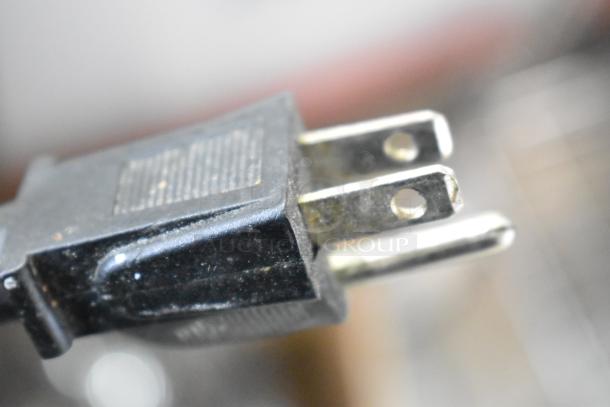 Close-up of a power plug on Vita-Mix VM0102/VM0103 blender. Blenders lack lids, operate at 120 volts, 1 phase.