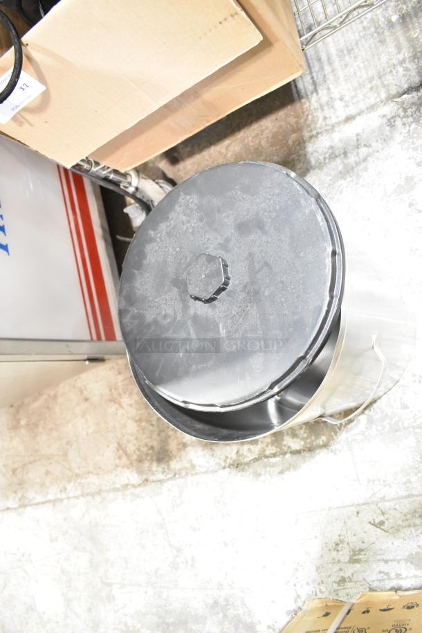 Curtis TC-7H Beverage Holder Dispenser, stainless steel with black lid, shows mild surface wear, suitable for commercial use.