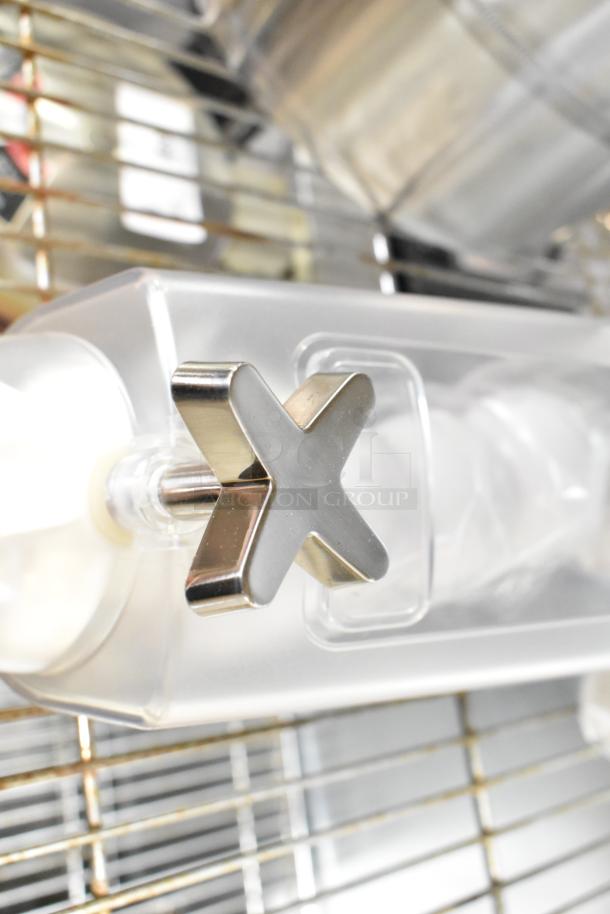 Clear poly dry food dispenser hopper with metal handle, in excellent condition. Ideal for storing grains or cereals.