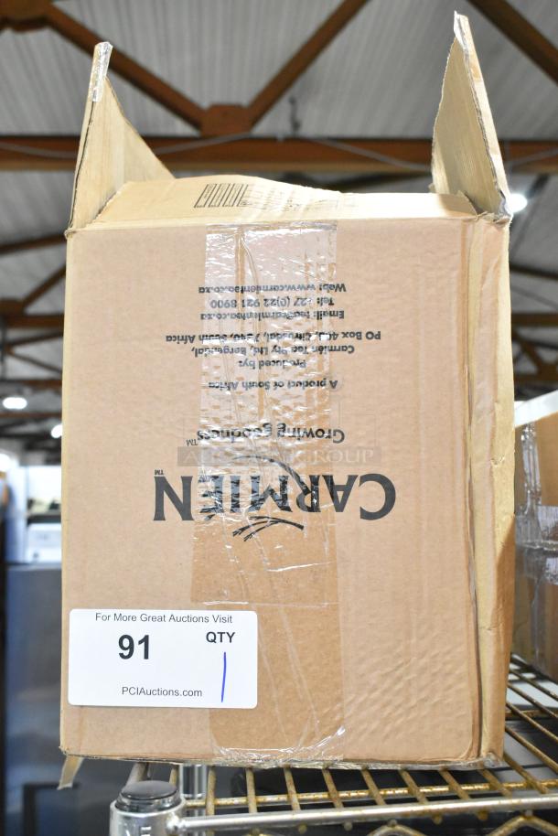 Cardboard box containing Cuisinart HandyPrep 3 Cup Food Processor. Box shows some wear, item details printed on side.