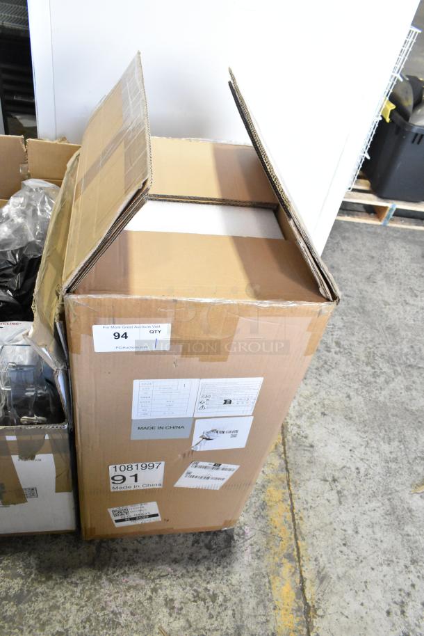 Cardboard box labeled "Made in China," containing a brand new, scratch and dent commercial steam milk frother.