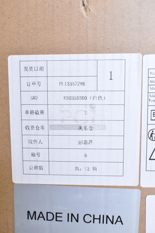 "Commercial steam milk frother, brand new, scratch and dent condition. Label shows SKU FS0350300, made in China."