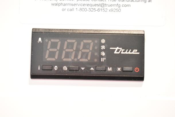Digital control panel for 2021 True TSCI-600R-G-PH commercial cooler, showing temperature and settings.