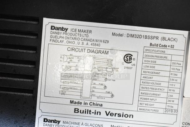 Danby DIM32D1BSSPR ice maker label detailing specs; 32 lbs daily production, 25 lbs storage, 3 cube sizes, built-in drain pump.