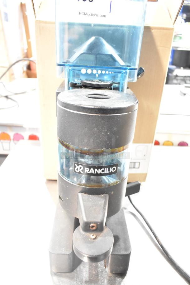 Rancilio MD 50/AT commercial espresso grinder, 110V, visible wear, Rancilio logo, blue hopper, countertop design.