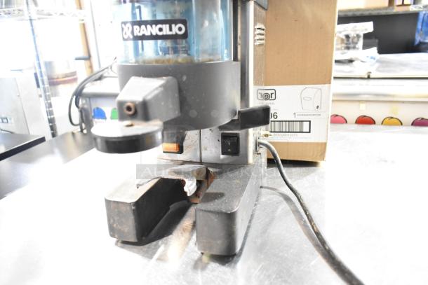 Rancilio MD 50/AT commercial espresso grinder, features countertop design, visible wear, 110V, 1 phase, model tag shown.