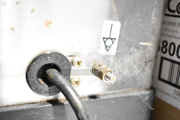 Rancilio MD 50/AT espresso grinder rear view showing power connection and grounding symbol, 110V, used condition.