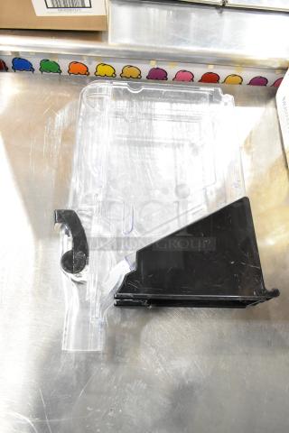 Clear plastic and black poly dry dispenser hopper with handle. Good condition, used for dry goods dispensing. Set of 7.