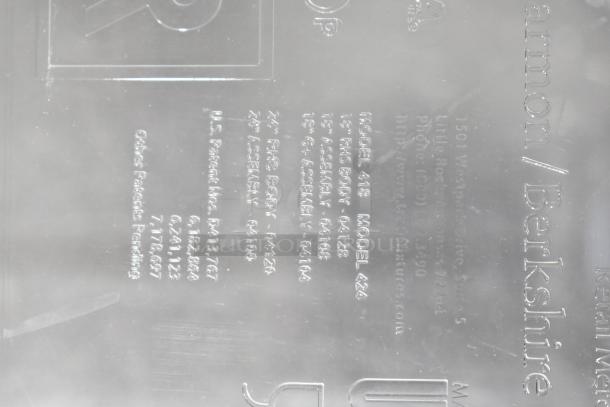 Clear poly dry dispenser hopper with embossed text showing patent numbers and contact details. Includes model numbers 418 and 424.