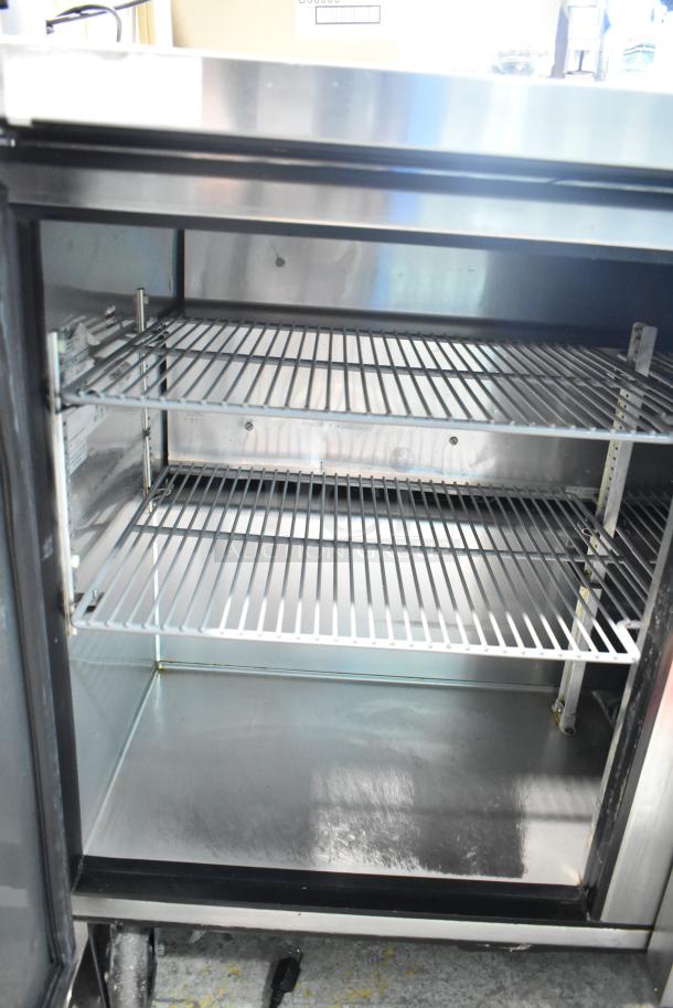 True TUC-48 undercounter cooler, 2 doors, commercial grade, 115V, 1 phase. Stainless steel interior with adjustable shelving.