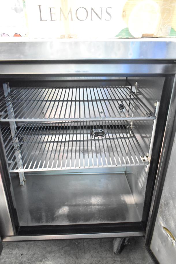 True TUC-48 Commercial 2 Door Undercounter Cooler with two shelves, 115 Volts, 1 Phase, in good condition.
