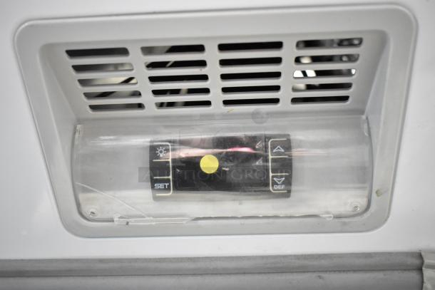 Dukers WD-700Y chest freezer control panel, showing temperature settings and defrost buttons.