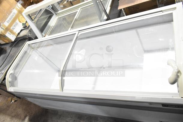 Dukers WD-700Y Commercial Chest Freezer Merchandiser with sliding glass doors, 115 volts, 1 phase. Clean interior, good condition.