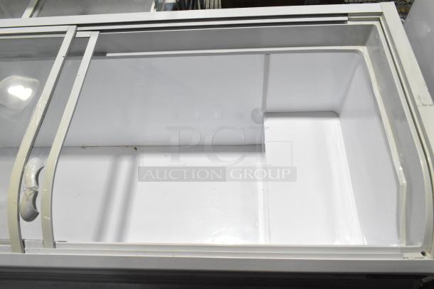 Dukers WD-700Y Commercial Chest Freezer Merchandiser, 115V 1 Phase, sliding glass top, spacious interior, excellent condition.