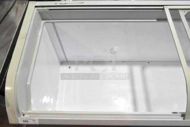 Dukers WD-700Y commercial chest freezer, featuring a glass top and spacious interior. In good condition. 115V, 1 phase.