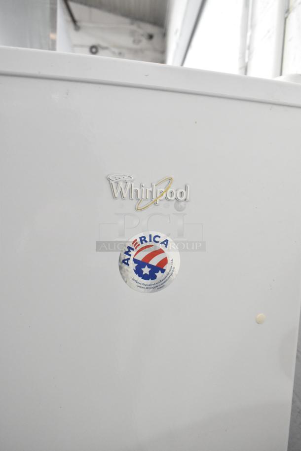 Whirlpool WRR56X13FW02 reach-in cooler, 115 volts, 1 phase, with Whirlpool branding and America sticker.
