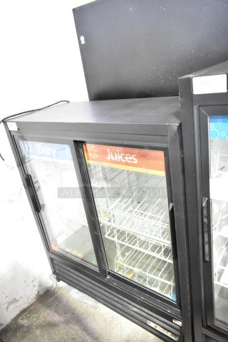 True GDM-41SL-54-LD commercial cooler, double glass doors, shelving inside, labels for dairy and juices, 115 volts, 1 phase.