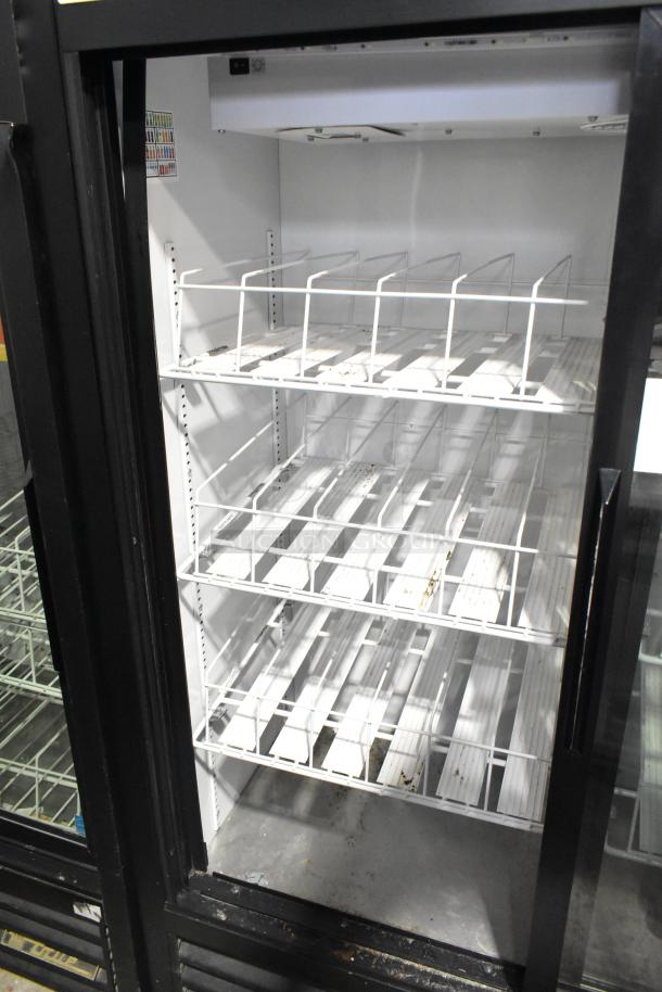 True GDM-41SL-60-HC-LD 2-door cooler merchandiser, 115V, clean interior, adjustable shelves, ideal for commercial use.