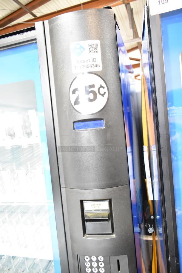 Crane 5800-4 metal vending machine, accepts bills, 25¢ price, Sam's asset ID label, 115V, 1 phase, used condition.