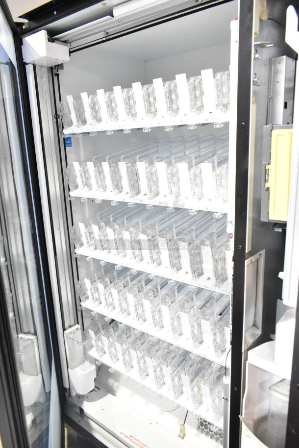 Crane 5800-4 commercial vending machine, metal, for bottled drinks, with bill acceptor, 115 volts, 1 phase; shelves visible.