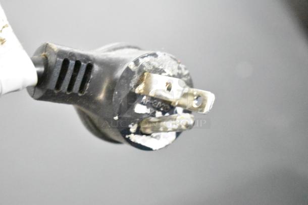 Close-up of a plug for a Crane 5800-4 Vending Machine. 115 Volts, 1 Phase power required.