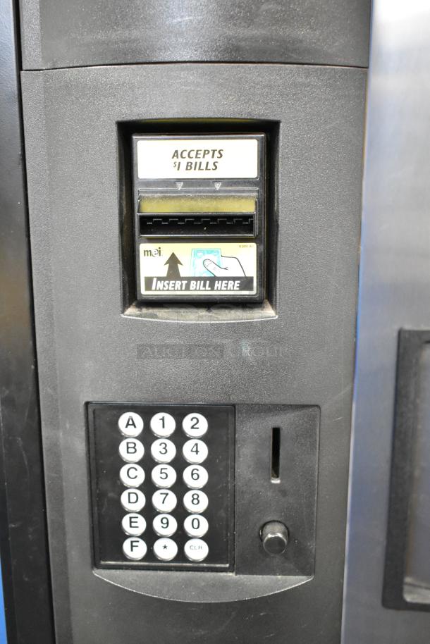 Crane 5800-4 metal vending machine with bill acceptor, keypad, supports 115V, 1-phase, in good condition.