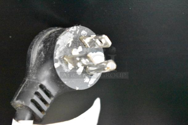 Crane 5800-4 drink vending machine plug, showing minor wear. 115 volts, 1 phase. Suitable for commercial use.