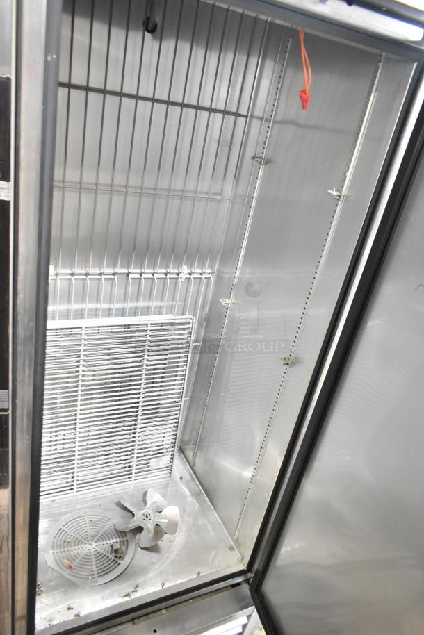 2016 True T-19F commercial freezer, single door, reach-in model, clean interior, 115V, 1 phase, with shelving.