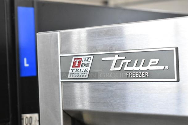 2016 True T-19F freezer, single door, 115 volts, 1 phase. Visible True Manufacturing label. Commercial use.
